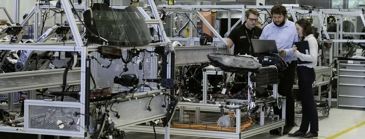 Engineers monitoring an automated production line